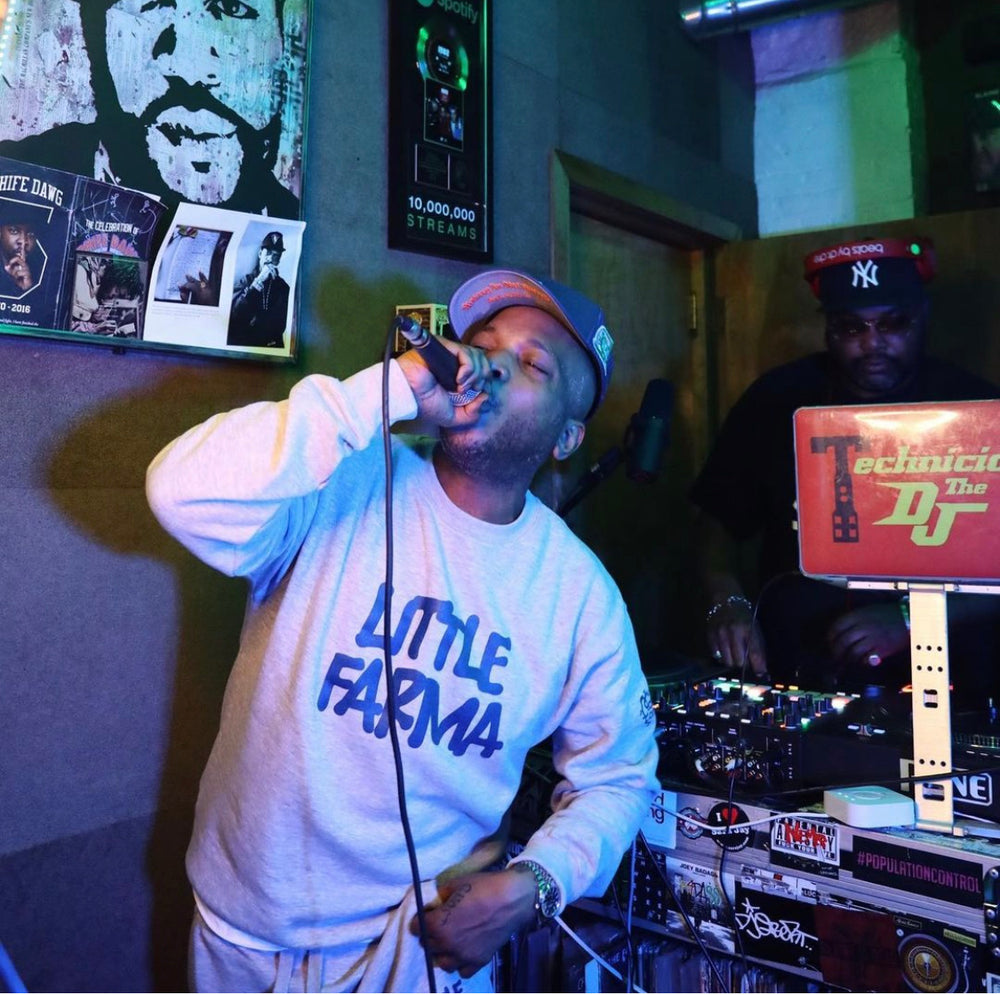 Little Farma sweatsuit worn by Styles P. while he raps in a mic